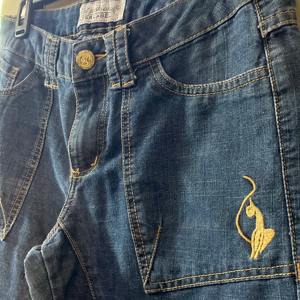 Brand: Baby Phat. Size: 5. Color: Blue with gold lining and logo.